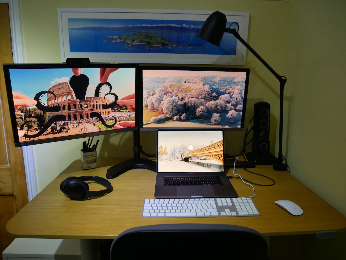 Desktop with a 2018 Macbook Pro and two external monitors